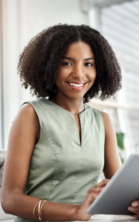 Shot of a young businesswoman using a digital tablet at her desk in a modern office